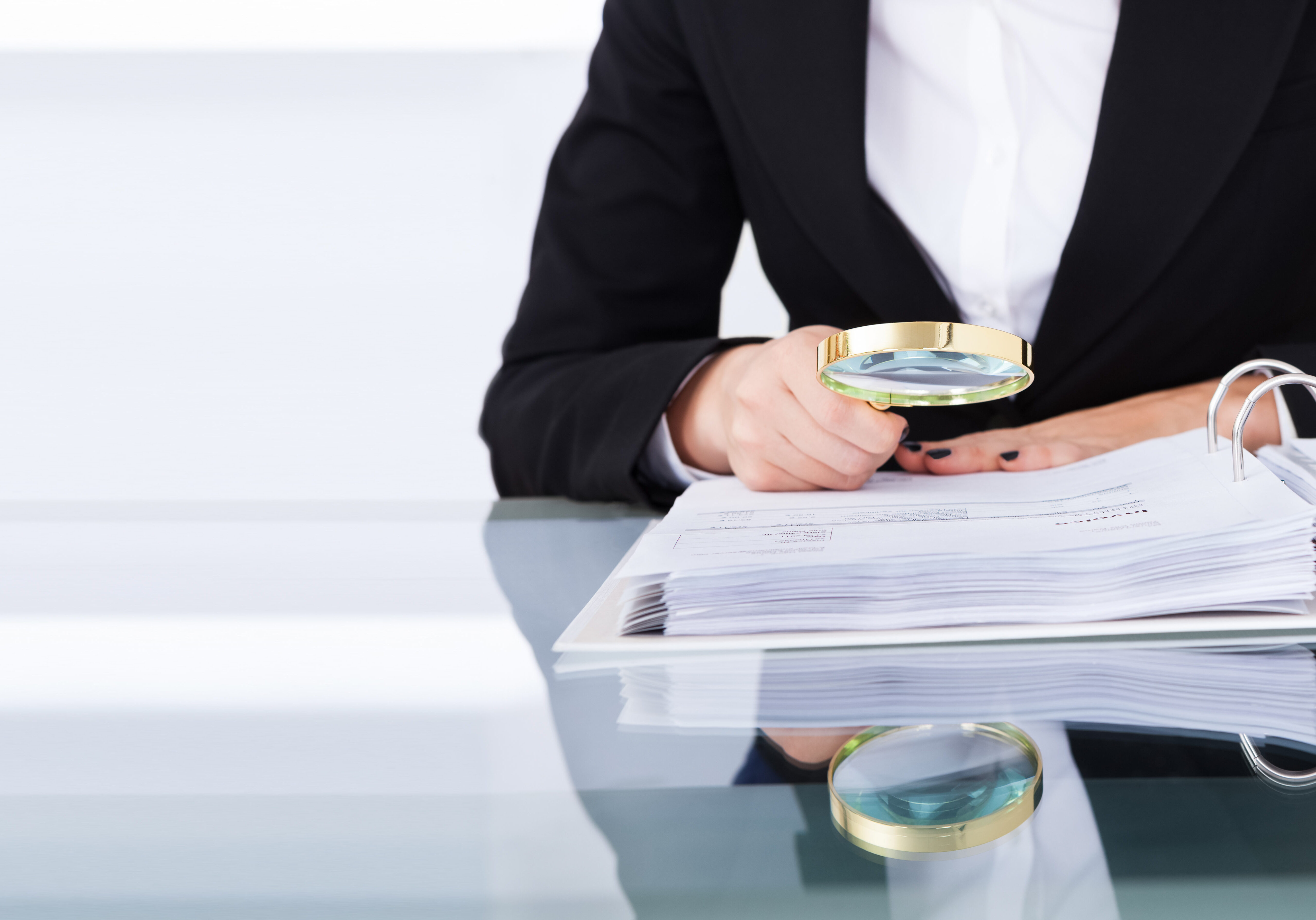 Auditor Doing Financial Audit And Tax Fraud Inspection Using Mag Auditor Doing Financial Audit And Tax Fraud Inspection Using Magnifying Glass